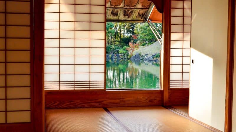 brown wooden door near body of water